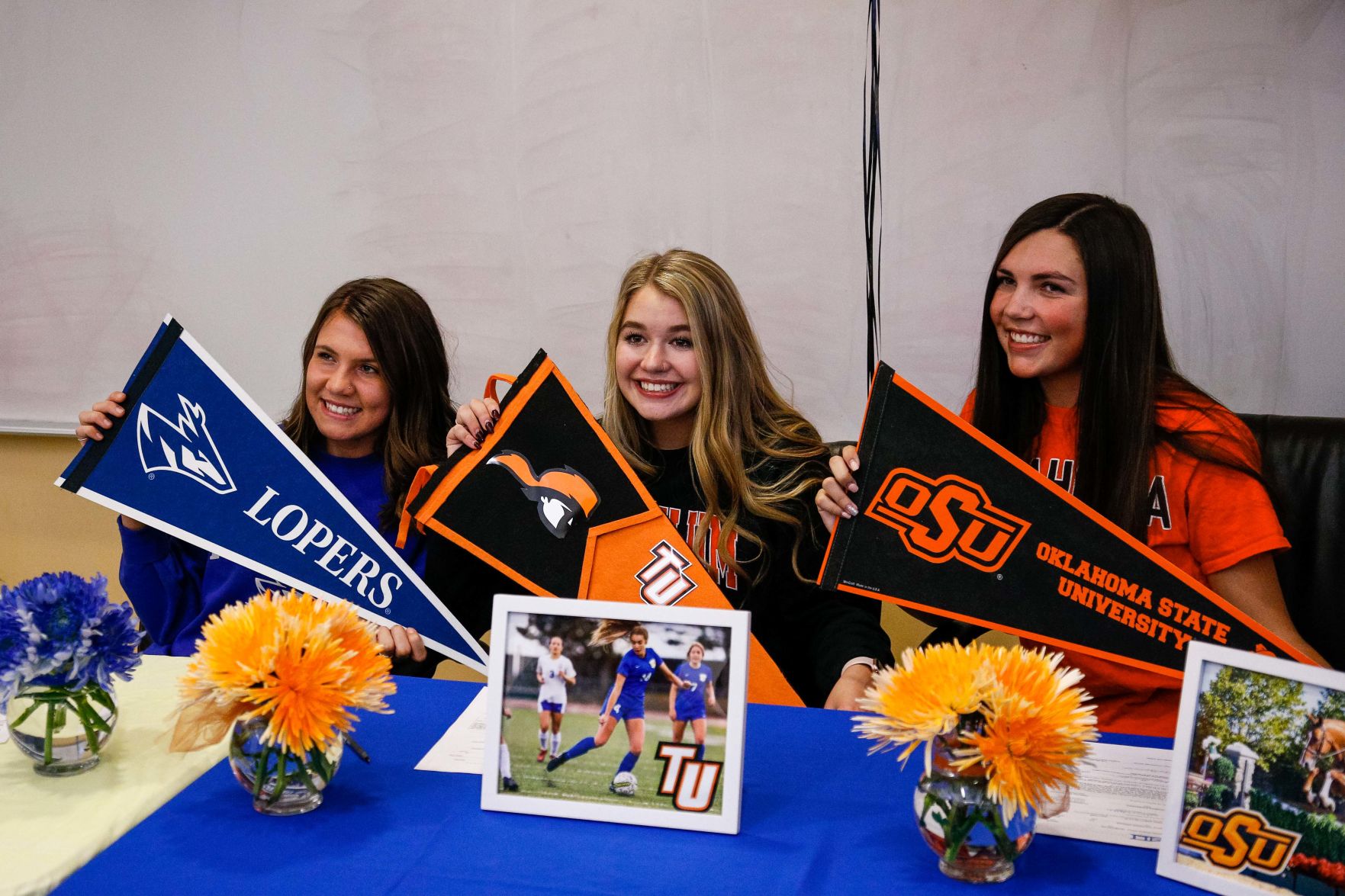 SIGNING DAY: Rampart athletes sign their National Letter of Intent